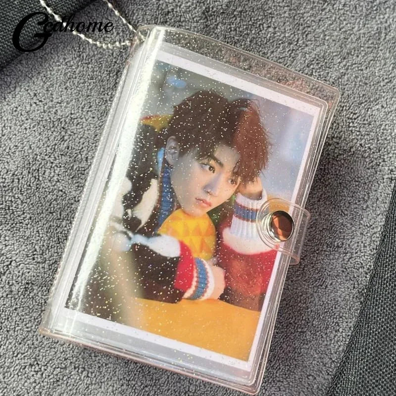 A clear plastic photo album containing a picture of a person with dark hair and light eyes.