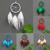 Handmade feather dreamcatchers in various colors and styles displayed against a gray background.