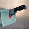 A black and red 3D axe fridge magnet with a handle, attached to a checklist paper.
