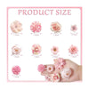 A collection of pink and white silk artificial flower heads of various sizes displayed on a hand.
