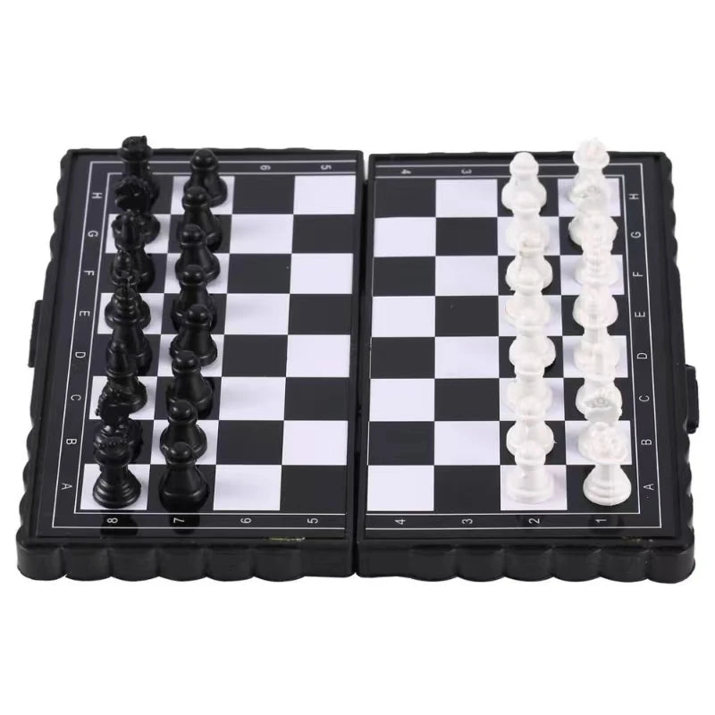 A portable folding magnetic chess set with black and white pieces on a chessboard.