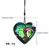 A heart-shaped crystal prism sun catcher pendant with a black cord and dimension measurements.
