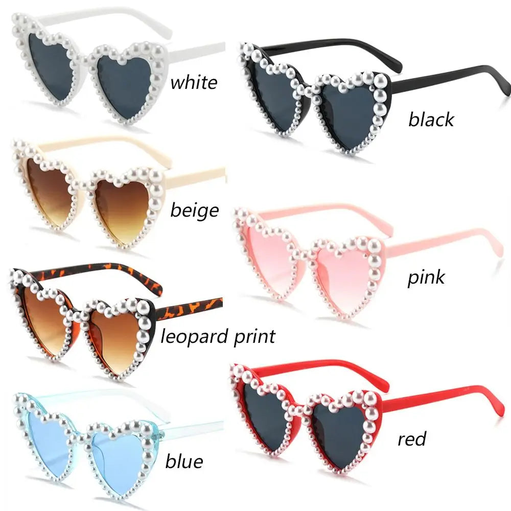 A collection of pearl-embellished heart-shaped sunglasses in various colors including white, black, beige, pink, leopard prin