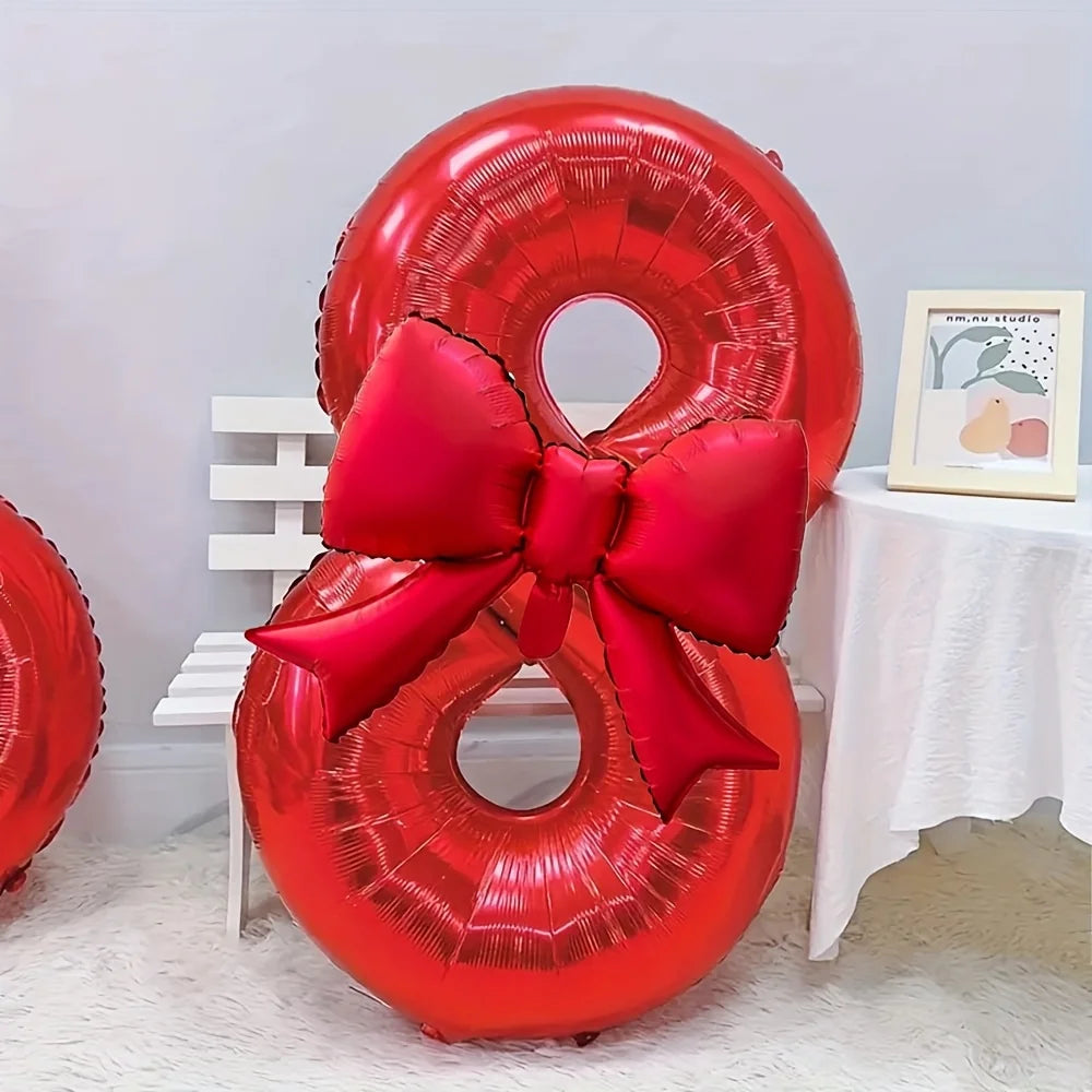 A large red foil number balloon shaped like the number 8, tied with a matching red bow.