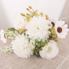 A bouquet of white hydrangeas and roses with small green leaves and brown accents.