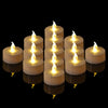 A row of glowing, warm white LED tealight candles set against a black background.
