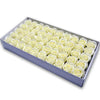 A rectangular box filled with numerous pale yellow artificial rose flower heads.