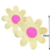 A single light yellow disposable flower napkin with a pink center is shown against a white background.