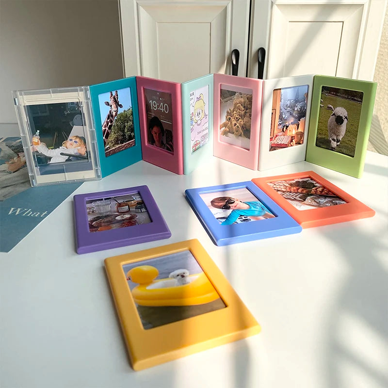 A collection of colorful magnetic photo frames displaying various photographs and scenes.
