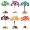 A collection of six natural crystal money tree decor pieces mounted on copper wire stems.