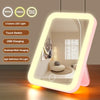 A rectangular LED vanity mirror with adjustable light colors and touch switch features is displayed on a wooden surface.