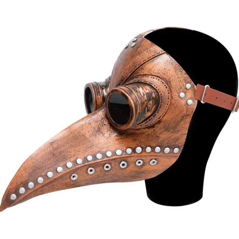 A close-up of a bronze-colored plague doctor mask made of natural latex with leather straps.