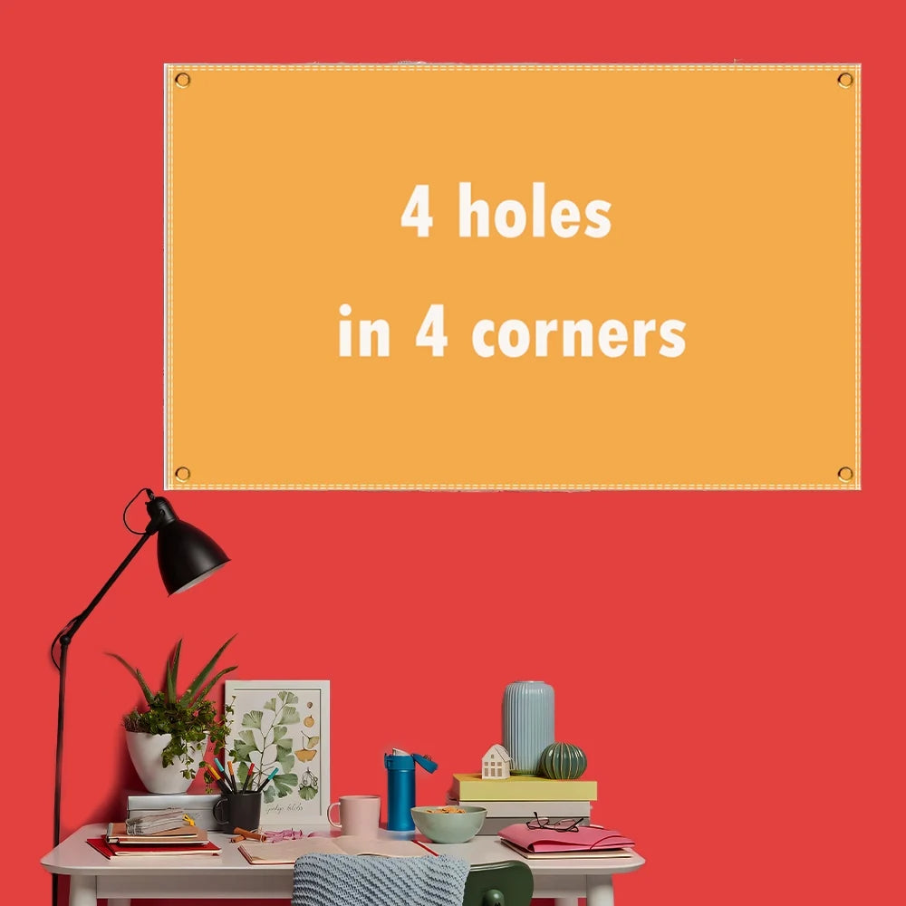 A bright orange framed sign on a red wall with the text 4 holes in 4 corners.