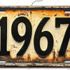 Señal de pared de aluminio vintage con el año 1967 grabado.