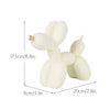 White resin sculpture of a dog shaped like a balloon, displayed with dimension lines.