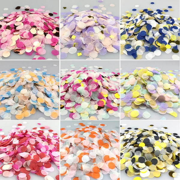 A collection of multicolor paper confetti in various shades including pink, purple, gold, blue, and white.