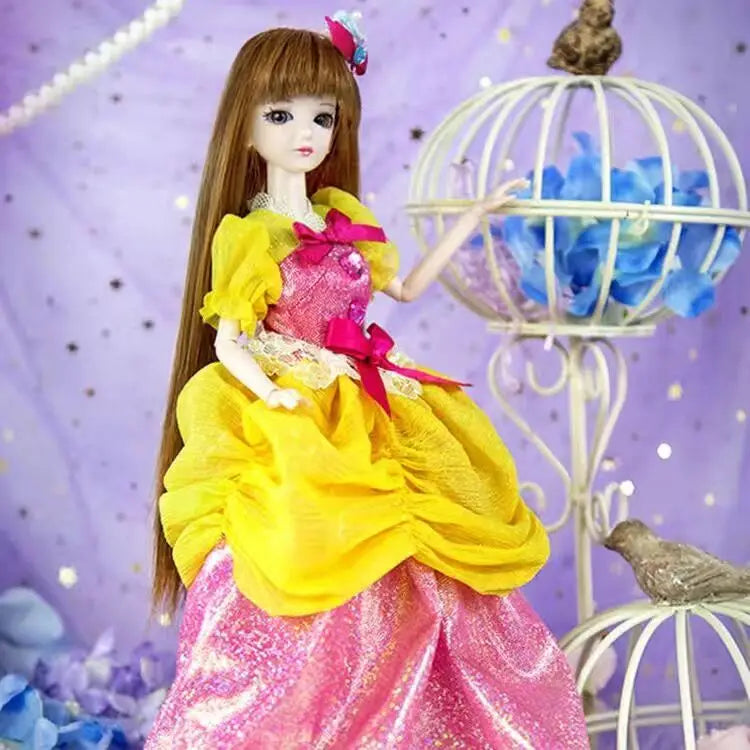 A princess ball-jointed doll with long brown hair wearing a yellow and pink sparkly dress in a purple setting.