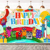 A colorful birthday party decoration featuring block figures and text on a wall.