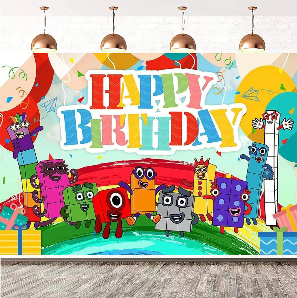 A colorful birthday party decoration featuring block figures and text on a wall.