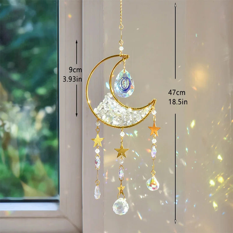 Gold moon suncatcher wind chime with prism accents hanging in a window