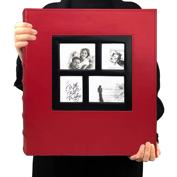 A red leather photo album with a black frame displaying four framed photos.