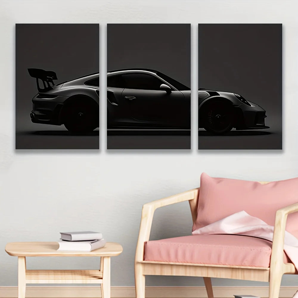 Three panels of black sports car silhouette canvas wall art displayed on a white wall.