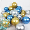 A collection of chrome metallic balloons in gold and blue shades arranged on a white surface.