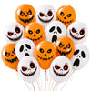 A bunch of orange and white latex balloons with spooky, carved pumpkin faces.