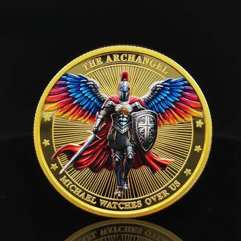 A gold medal coin featuring a winged warrior figure of the Archangel Michael with a shield and sword.