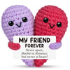 Two handcrafted crochet animal dolls, one purple and one red, with a message card that reads My Friend Forever.