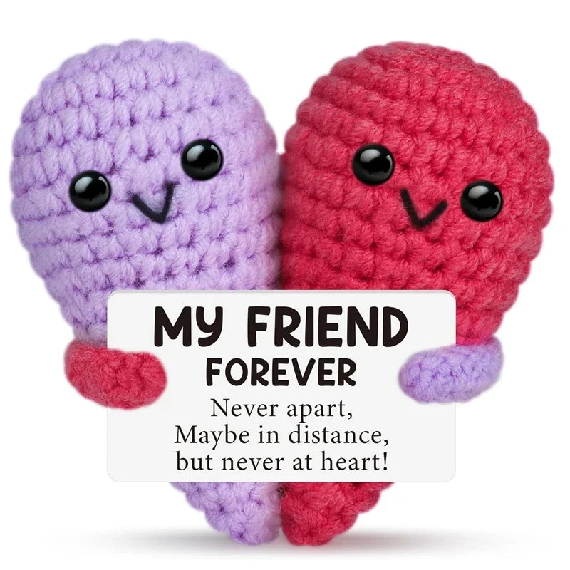 Two handcrafted crochet animal dolls, one purple and one red, with a message card that reads My Friend Forever.