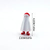 A white cartoon animal figurine with a red hat and red feet, shown against a white background.
