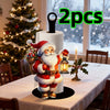 A festive Santa Claus kitchen paper towel holder with a beard and festive clothing displayed on a white table.