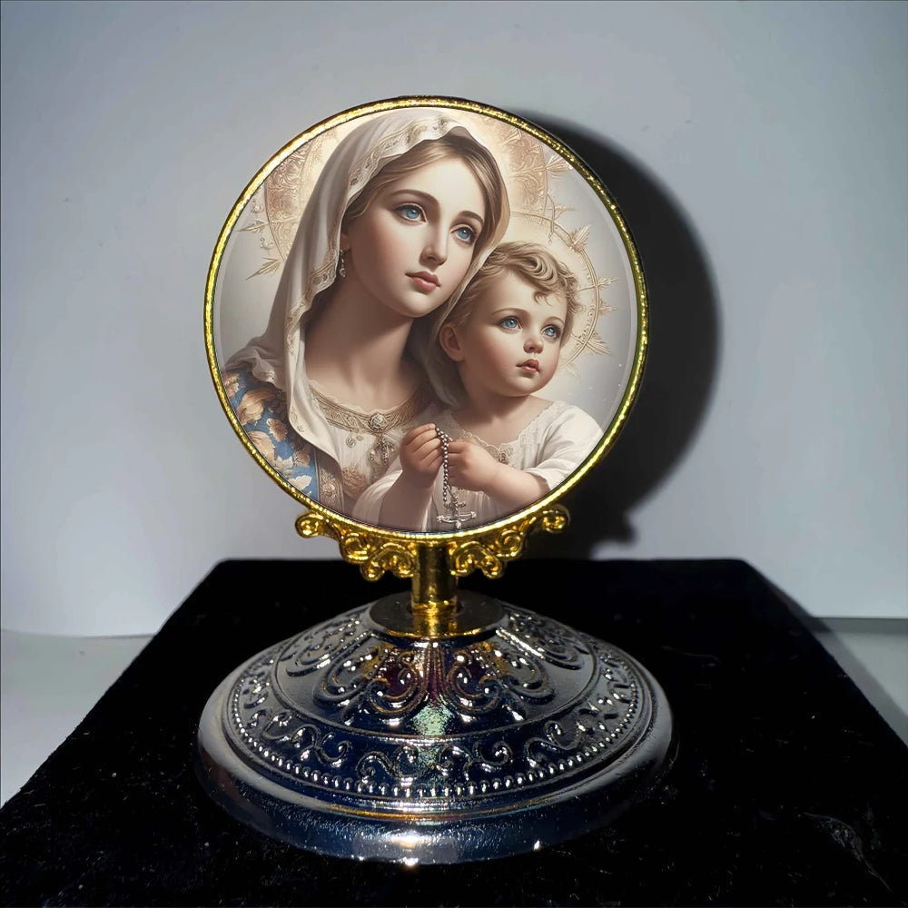 A framed image of the Virgin Mary and the Christ Child in a halo set on a decorative gold stand.