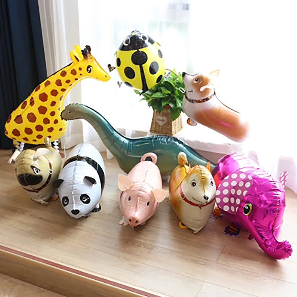 A collection of cartoon farm animal foil balloons including a giraffe, ladybug, dinosaur, fox, pig, and elephant.
