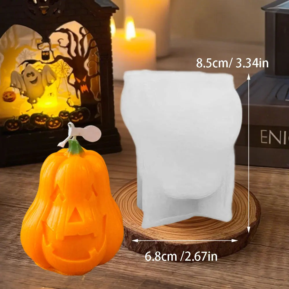 A white silicone mold shaped like a pumpkin is displayed next to an orange Halloween pumpkin.