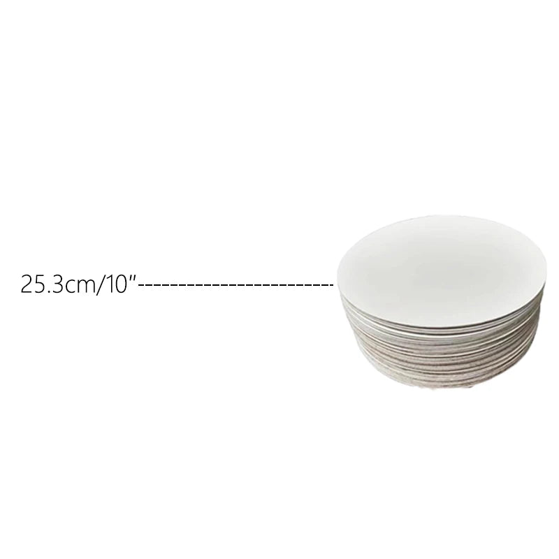 A stack of round white cardboard cake boards, with a measurement line indicating 25.3cm or 10 inches.