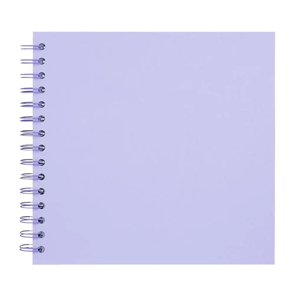 A blank purple spiral-bound notebook or scrapbook album.