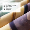 Close-up of a fabric tapestry featuring purple and olive tones with crisp lines.
