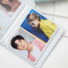 A white photo album with a clear cover displaying two photos: a woman and a man.