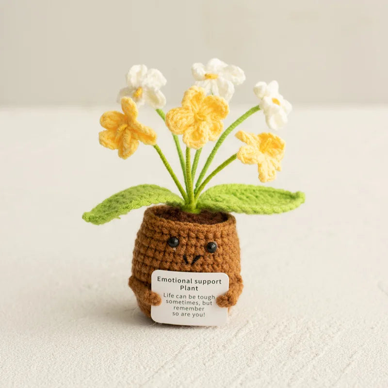 Handmade crochet sunflower plant with yellow and white flowers in a brown pot