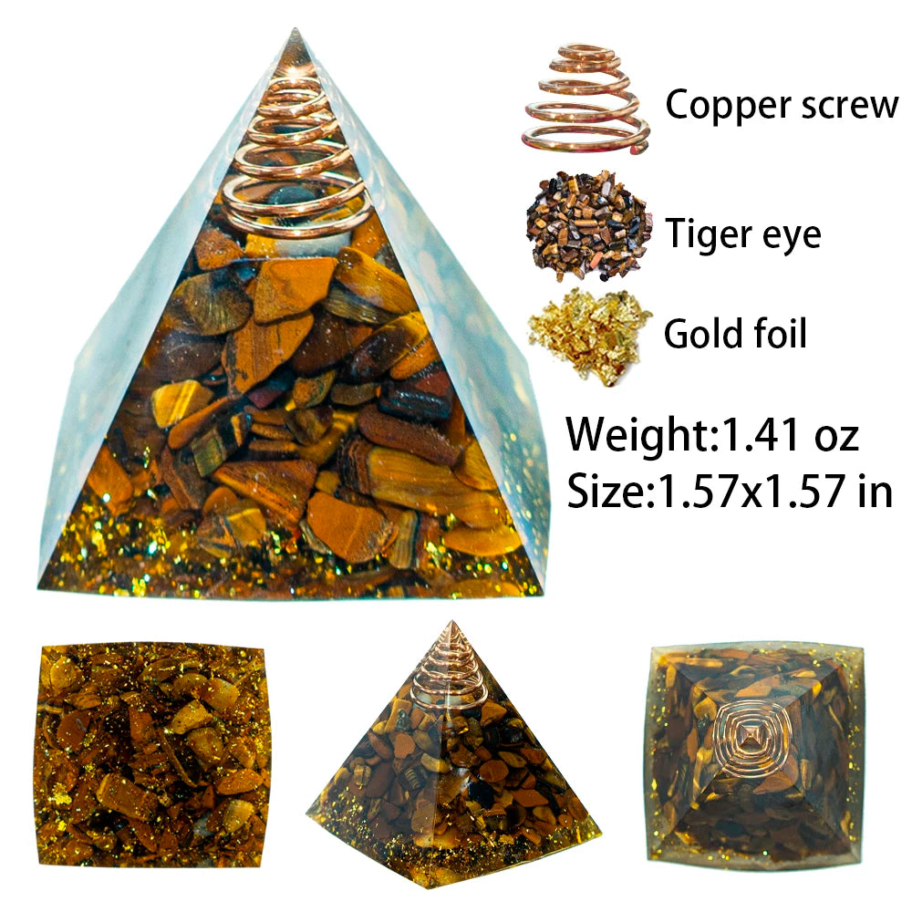 A pyramid-shaped crystal display featuring a copper screw, tiger eye, and gold foil crystals.