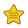 A yellow star enamel pin with the text did not commit arson.