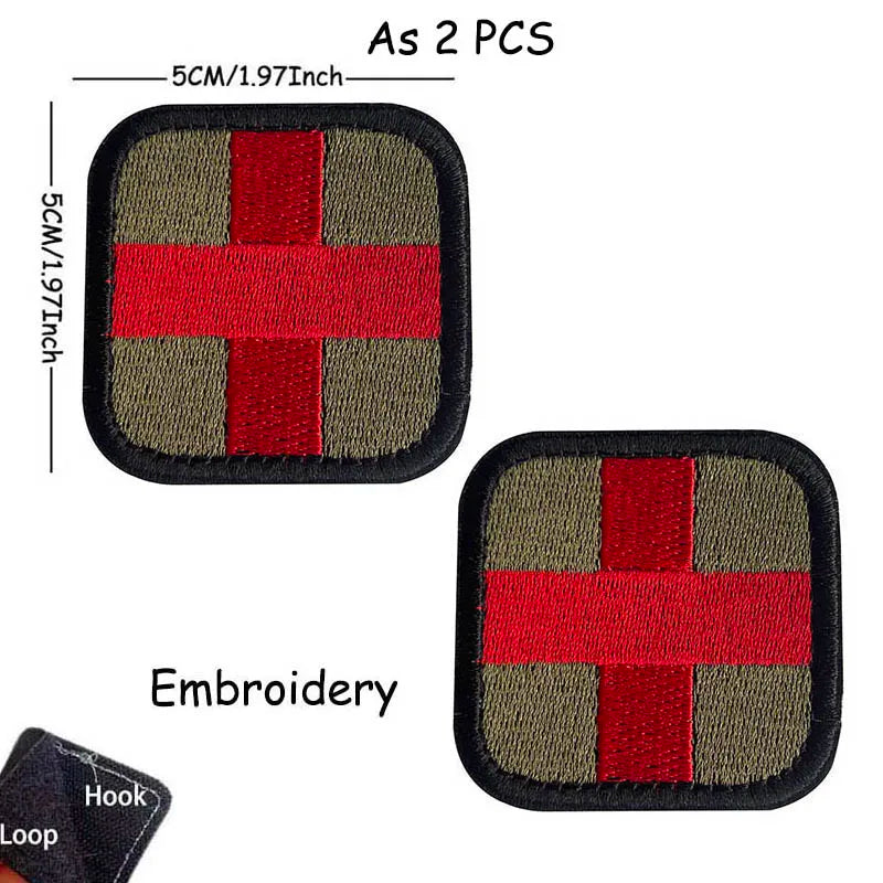 Two embroidered medical cross tactical morale patches on black backing with a hook and loop.