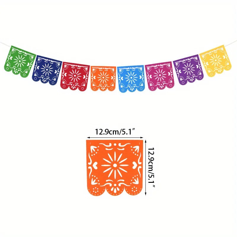A string of colorful felt papel picado banners in various shades of green, blue, purple, and yellow.