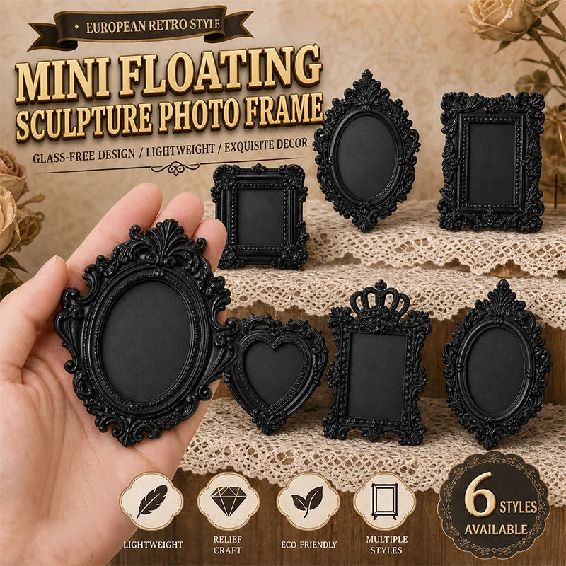 A hand holds several black resin floating sculpture photo frames with ornate edges on a textured background.