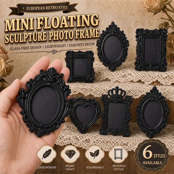 A hand holds several black resin floating sculpture photo frames with ornate edges on a textured background.