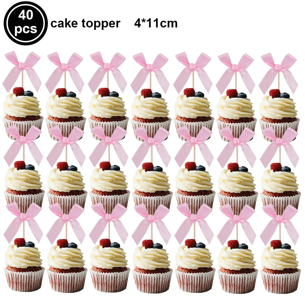 A set of 40 pink bow cupcake toppers measuring 4x11cm.