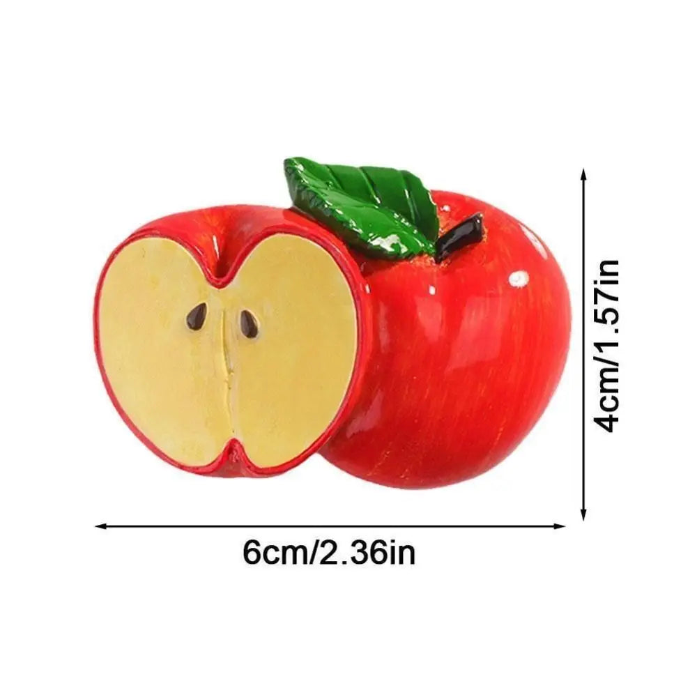 A bright red apple with a green leaf, used as a 3D simulation fruit fridge magnet.