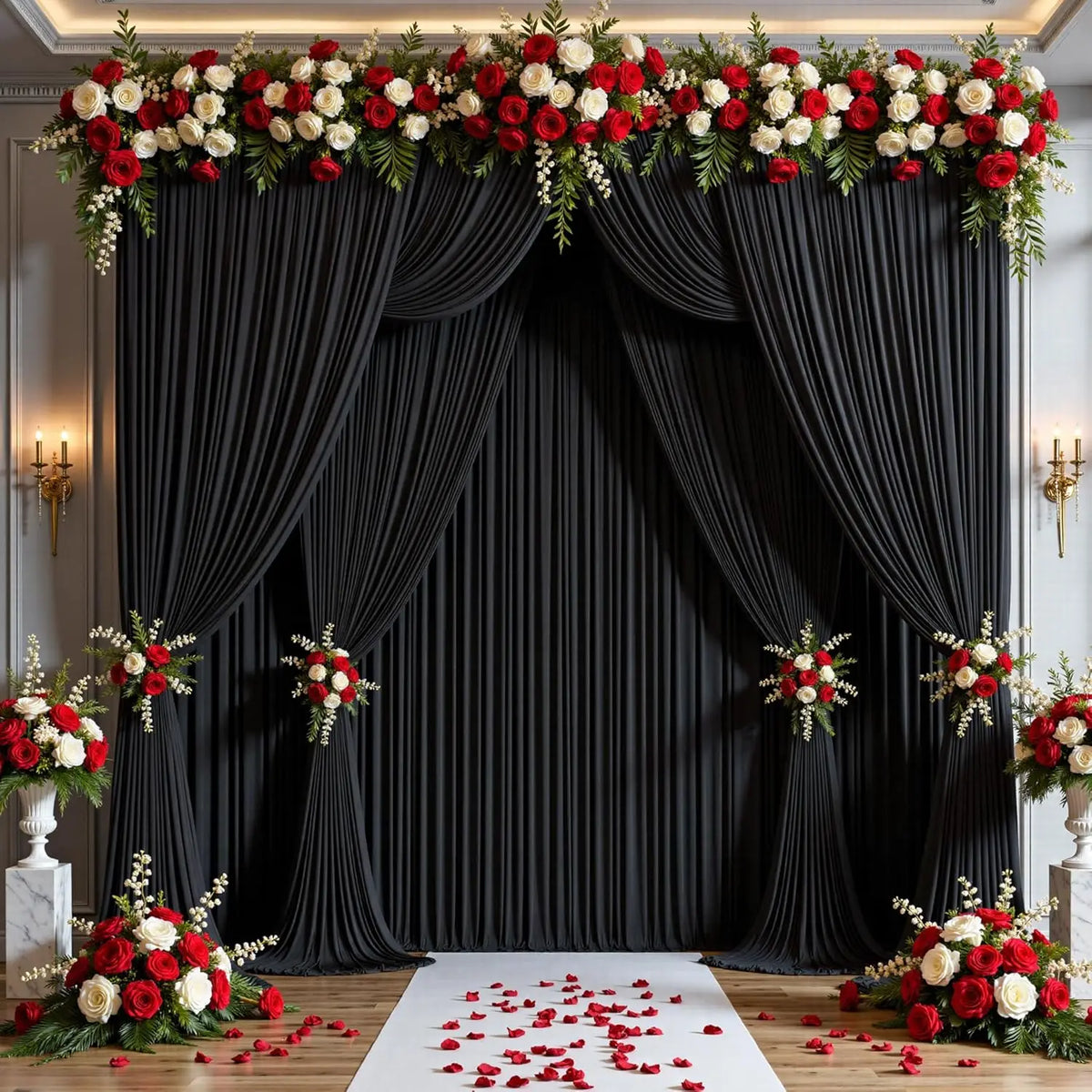 Elegant rectangular backdrop with black drapes adorned with red and white floral arrangements on the floor.